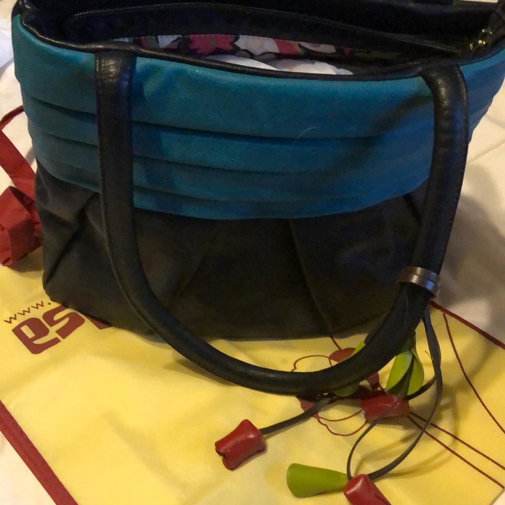 Black shoulder bag with teal accent
